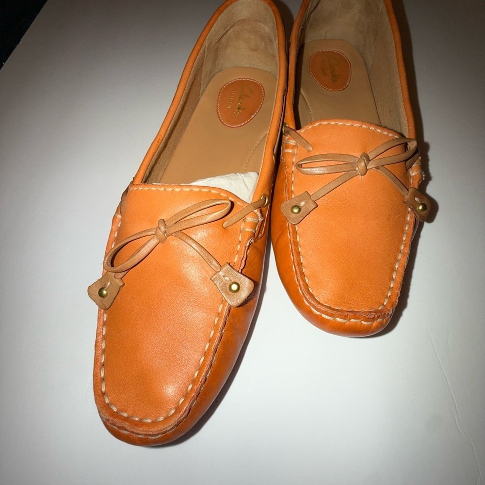 Clarks Artisan Dunbar Racer driving moccasins in an orange/cognac leather color